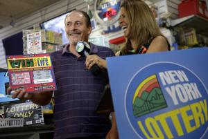 Bruce Magistro talks to reporters and lottery representative …