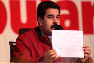 Venezuelan President Nicolas Maduro holds a paper that&nbsp;&hellip;