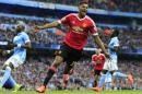 United's Marcus Rashford celebrates after scoring his side's first goal during the English Premier League soccer match between Manchester City and Manchester United at the Etihad stadium in Manchester, Sunday, March 20, 2016.(AP Photo/Jon Super)