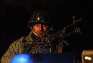 Afghan policeman keeps watch at the scene of an explosion&nbsp;&hellip;