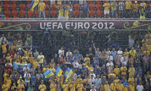 Heavy rains fall prior to the Euro 2012 soccer championship Group D match between Ukraine and France in Donetsk, Ukraine, Friday, June 15, 2012. The match was suspended after a few minutes due to the weather. (AP Photo/Vadim Ghirda)