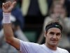 Switzerland's Roger Federer thumbs up after defeating France's Gille Simon in their fourth round match of the French Open tennis tournament at the Roland Garros stadium Sunday, June 2, 2013 in Paris. (AP Photo/Petr David Josek)