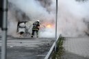 Firemen extinguish a burning car in the Stockholm suburb of Rinkeby after youths rioted in several different suburbs around Stockholm for a fourth consecutive night, late May 23, 2013. Youths in immigrant-heavy Stockholm suburbs torched cars and threw rocks at police in riots believed to be linked to a deadly police shooting of a local resident in the suburb of Husby. (AP Photo/Scanpix, Fredrik Sandberg) SWEDEN OUT