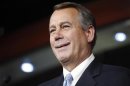 U.S. House Speaker Boehner smiles during news conference at the U.S. Capitol in Washington