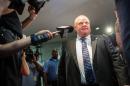 Toronto Mayor Rob Ford leaves his office amid a crush of cameras at city hall in Toronto, Canada on June 30, 2014
