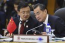 China's Foreign Minister Wang Yi listens to delegate during 14th ASEAN Plus Three Foreign Ministers Meeting in Bandar Seri Begawan