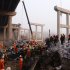In this Feb. 1, 2013 photo provided by China's Xinhua News Agency, rescuers work at the accident locale where an 80 meter (260 foot) section of an expressway bridge collapsed in Mianchi County, Sanmenxia City in central China's Henan Province.  An elevated portion of highway in central China collapsed on Friday after a truck loaded with fireworks for Lunar New Year celebrations exploded, killing at least nine people and sending vehicles plummeting 30 meters (about 100 feet) to the ground. (AP Photo/Xinhua, Zhao Peng) NO SALES