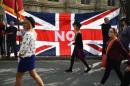 Loyalists march past a Union flag during a pro-Union rally in Edinburgh