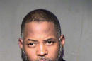 FILE - This undated file booking photo from the Maricopa County, Ariz., Sheriff's Department shows Abdul Malik Abdul Kareem. The Arizona man is set for trial Tuesday, Feb. 16, 2016, on terror charges linked to Islamic State. Kareem is accused of providing the guns used in an attack at a Prophet Muhammad cartoon contest in Texas. (Maricopa County Sheriff's Department via AP, File)