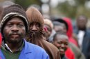 Zimbabweans wait to cast their vote in Mbare township