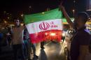 Iranians celebrate on the streets following a nuclear deal with major powers, in Tehran