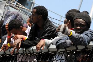 Migrants wait to disembark from the German Navy ship&nbsp;&hellip;