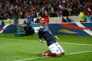 French soccer team forward Antoine Griezmann, reacts after scoring against Paraguay during their friendly soccer match, at the Allianz Riviera Stadium, in Nice, southeastern France, Sunday, June 1, 2014. France is preparing for the upcoming soccer World Cup in Brazil starting on 12 June. (AP Photo/Claude Paris)