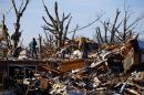 Residents sort through the rubble after their home was destroyed during a tornado in Washington