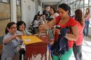 People queue at a polling station in Montevideo, on October 26, 2014