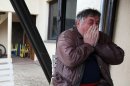 Radmilo Bogdanovic, brother of Ljubisa Bogdanovic cries in village of Velika Ivanca, Serbia, Tuesday, April 9, 2013. Ljubisa Bogdanovic a 60-year-old man gunned down 13 people, including a baby, in a house-to-house rampage in a quiet village on Tuesday before trying to kill himself and his wife, police and hospital officials said. Belgrade emergency hospital spokeswoman Nada Macura said the man, identified as Ljubisa Bogdanovic, used a handgun in the shooting spree at five houses. The dead included six women. (AP Photo/Darko Vojinovic)