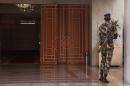 An armed Senegal soldier patrols by a doorway as Security experts gather for talks in Dakar, Senegal, Monday, Nov. 11, 2015. Hundreds of security experts are gathered in Senegal's capital to strategize against the growing threat posed by Boko Haram and other jihadist groups in the region.(AP Photo/Baba Ahmed)