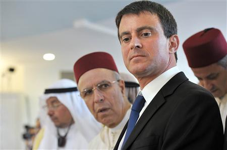 France's Interior Minister Manuel Valls (R) and Morocco's Minister of Endowments and Islamic Affairs Ahmed Toufiq attend with other guests the official inauguration of Grand Mosque in Strasbourg, September 27, 2012. REUTERS/Frederick Florin/Pool