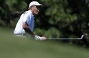 President Barack Obama watches his shot during a golf outing at Mink Meadows Golf Club, in Vineyard Haven, Mass., on the island of Martha's Vineyard, Thursday, Aug. 15, 2013. President Obama and his wife Michelle are vacationing on the island. (AP Photo/Steven Senne)