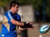 Richie McCaw of New Zealand's All Blacks passes the ball during a training session ahead of their Rugby Championship match against Argentina in Quilmes