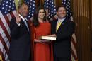 House Speaker John Boehner of Ohio poses for a photo with Rep. Ron DeSantis, R-Fla., right, and his wife Casey Black DeSantis, center, to re-enact the oath-of-office, Tuesday, Jan. 6, 2015, on Capitol Hill in Washington. (AP Photo/Susan Walsh)