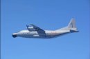 A Chinese military plane Y-8 airborne early warning plane flies through airspace between Okinawa prefecture's main island and the smaller Miyako island in southern Japan out over the Pacific, in this handout photo