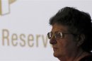 South African central bank Governor Gill Marcus is seen against a partial logo of of the Reserve Bank after making an announcement in Pretoria