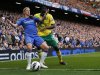 Norwich City's Leon Barnett (R) challenges Chelsea's Fernando Torres during their English Premier League soccer match in London
