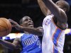 Dallas Mavericks guard Darren Collison, left, goes to the basket in front of Oklahoma City Thunder forward Serge Ibaka, right, during the first quarter of an NBA basketball game in Oklahoma City, Thursday, Dec. 27, 2012. (AP Photo/Alonzo Adams)
