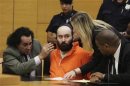 Aron confers with his attorneys while pleading guilty to killing an 8-year-old boy named Kletzky as the boy was walking home alone during a proceeding at the state Supreme Court of Brooklyn in New York