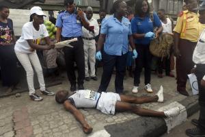 Medical officials attend to a runner affected by Lagos&#39;s&nbsp;&hellip;