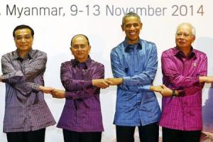 File photo of Asian leaders joining hands as they pose &hellip;