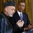 U.S. President Obama listens to Afghan President Karzai during joint news conference at the White House in Washington