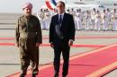 French president Francois Hollande (R) walks with Iraqi Kurdish leader Massud Barzani in Arbil, the capital of the Kurdish autonomous region in northern Iraq, on September 12, 2014