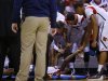Louisville Cardinals hold hands with Kevin Ware after he broke his leg against Duke during their Midwest Regional NCAA men's basketball game in Indianapolis