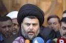 Iraqi Shi'ite cleric Moqtada al-Sadr speaks to the media during a visit to the Our Lady of Salvation Church in Baghdad