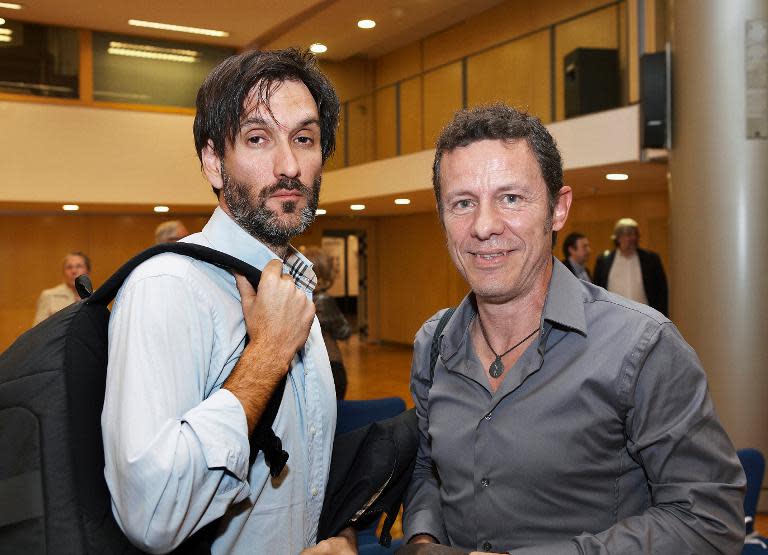 A handout picture obtained on December 11, 2013 shows Spanish freelance photographer Ricardo Garcia Vilanova (L) and El Mundo daily newspaper correspondent Javier Espinosa in Barcelona on May 24, 2012