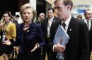 FILE - This Nov. 11, 2009 file photo shows then-Secretary of State Hillary Rodham Clinton walking with a then-Deputy Chief of Staff Jake Sullivan in Singapore. Last summer, Sullivan was traveling with his boss, Hillary Rodham Clinton, when he suddenly disappeared during a stop in Paris. He showed up again a few days later, rejoining Clinton's traveling contingent in Mongolia. In between, Sullivan secretly had jetted to the Middle Eastern nation of Oman to meet with officials from Iran, people familiar with the trip said. The July 2012 meeting is one of the Obama administration's earliest known face-to-face contacts with Iran and reveals that Sullivan _ who moved from the State Department to the White House earlier this year _ was personally involved in the administration's outreach to the Islamic republic far earlier than had been reported. (AP Photo/Ng Han Guan, File)
