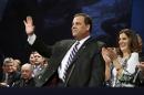 In this Jan. 21, 2014, photo, New Jersey Gov. Chris Christie waves as he stands with his wife Mary Pat Christie during a gathering for his swearing in for his second term in Trenton, N.J. As controversy grows around Christie, he's finding support in the nation's Hispanic community. Some minority leaders usually aligned with Democrats are giving the Republican governor the benefit of the doubt. They're willing to support Christie, in part, because he has aggressively courted Hispanic voters throughout his first term. (AP Photo/Mel Evans)