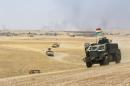 Military vehicles of the Kurdish Peshmerga forces are seen on the southeast of Mosul