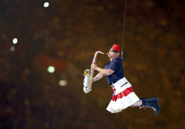 A performers take part in the closing ceremony of the London 2012 Olympic Games at the Olympic Stadium