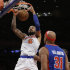 New York Knicks center Tyson Chandler (6) dunks as Detroit Pistons forward Charlie Villanueva (31) watches from the floor in the first half of an NBA basketball game at Madison Square Garden in New York, Monday, Feb. 4, 2013. (AP Photo/Kathy Willens)