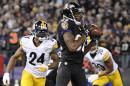 Baltimore Ravens wide receiver Torrey Smith, center, makes a touchdown catch in front of Pittsburgh Steelers cornerback Ike Taylor (24) and strong safety Will Allen in the first half of an NFL football game on Thursday, Nov. 28, 2013, in Baltimore. (AP Photo/Nick Wass)