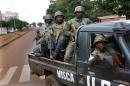 FILE-In this file photo taken on Thursday, May 29, 2014, African Union MISCA troops from Cameroon patrol in Bangui, Central African Republic. The United Nations took over a regional African peacekeeping mission in Central African Republic on Monday, Sept. 15, nine months after sectarian violence erupted that has left at least 5,000 people dead and has forced tens of thousands of Muslims to flee into exile in neighboring countries. (AP Photo/Jerome Delay,File)