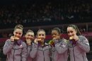 Team U.S.A members, Gabrielle Douglas, Alexandra Raisman, Jordyn Wieber, McKayla Maroney and Kyla Ross celebrate with their gold medals in London