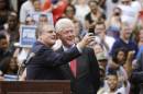 U.S. Sen. Mark Pryor, D-Ark., left, takes a selfie with former President Bill Clinton during a rally for Democrats at the University of Central Arkansas in Conway, Ark., Monday, Oct. 6, 2014. Clinton is headlining a series of rallies around the state this week to support Arkansas Democrats. (AP Photo/Danny Johnston)