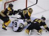 Bruins' Jagr and Seidenberg keep the puck away from Penguins' Dupuis and Bruins goalie Rask during the third period in Game 4 of their NHL Eastern Conference finals hockey playoff series in Boston