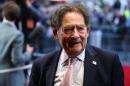 Former British Conservative Party Minister Nigel Lawson poses for pictures as he arrives for the world premiere of the film 'Brexit: the Movie' in London's Leicester Square, on May 11, 2016