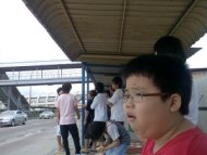 Gaping kid at bus stop