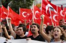 Protesters shout slogans during an anti-government protest at Taksim Square in Istanbul